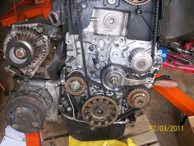 oil pump and manual tensioner